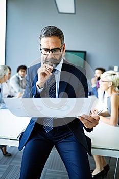 Businesspeople discussing together in conference room during meeting at office