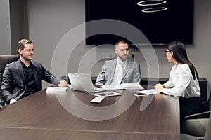 Businesspeople discussing together in conference room during meeting at office