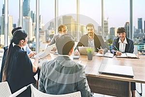 Businesspeople discussing together in conference room during meeting at office