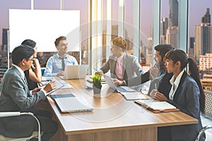 Businesspeople discussing together in conference room during meeting at office