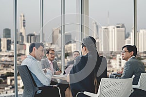 Businesspeople discussing together in conference room during meeting at office