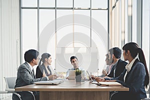 Businesspeople discussing together in conference room during meeting at office