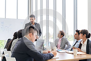 Businesspeople discussing together in conference room during meeting at office