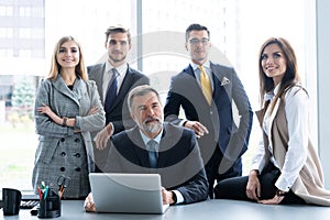 Businesspeople discussing together in conference room during meeting at office.