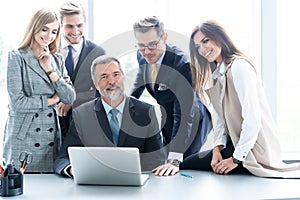 Businesspeople discussing together in conference room during meeting at office.