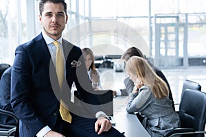 Businesspeople discussing together in conference room during meeting at office.