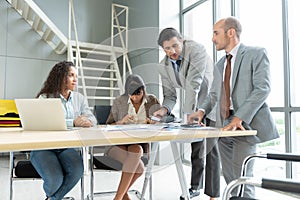 Businesspeople discussing together in conference room during meeting at office