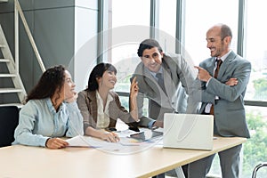 Businesspeople discussing together in conference room during meeting at office