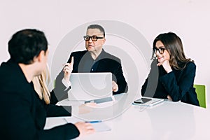 Businesspeople discussing together in conference room during meeting at office. Team work