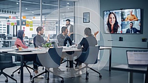 Businesspeople do Video Conference Call with Big Wall TV in Office Meeting Room. Diverse Team of C