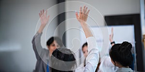 Businesspeople giving a high five to male colleague in meeting teamwork. business professionals high five during a