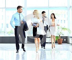 Businesspeople group walking at modern