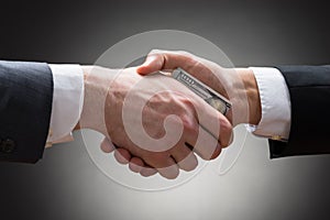 Businesspeople hands with money