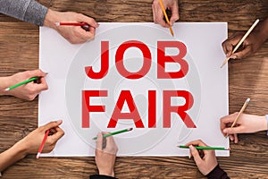 Businesspeople Hands Writing Job Fair