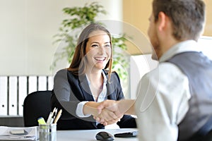 Businesspeople handshaking after deal or interview