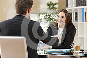 Businesspeople handshaking after negotiation