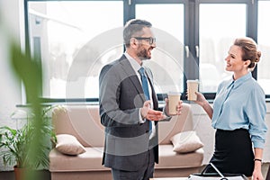 businesspeople having chit-chat while drinking coffee photo