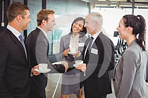 Businesspeople having a discussion during break time