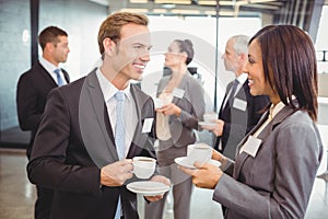 Businesspeople having a discussion during break time