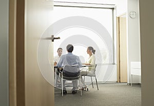 Businesspeople Having A Meeting In Boardroom