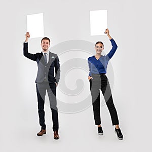 Businesspeople holding blank white advertising billboard at studio, collage