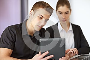 Businesspeople looking at tablet pc