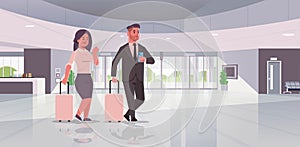 Businesspeople with luggage couple standing at reception area business man woman holding suitcase contemporary lobby