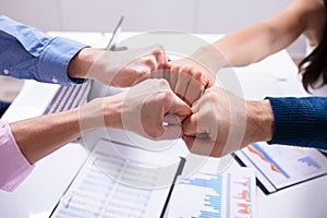 Businesspeople Making Fist Bump