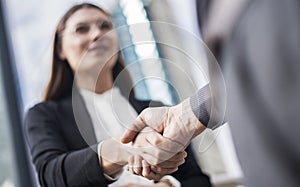 Businesspeople making hand shake in the city photo