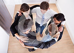 Businesspeople making huddle