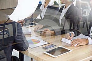 Businesspeople meeting in conferance  room with paperwork