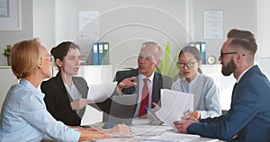 Businesspeople meeting in modern boardroom discussing startup project