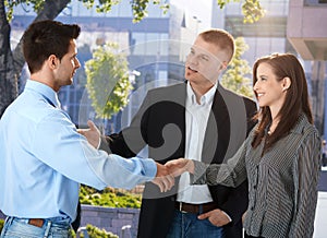 Businesspeople meeting outside of office