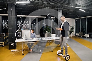 Businesspeople in the office at night working late.