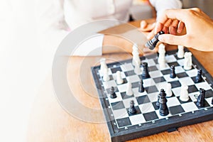 Businesspeople playing chess in office