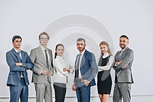 businesspeople posing near board after training