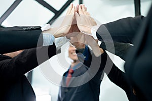 Businesspeople raise hand high fives together.businesspeople celebrating in office success deal business, business