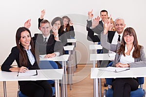 Businesspeople Raising Their Hands