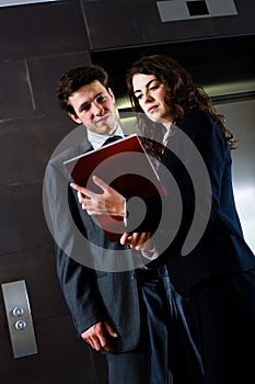 Businesspeople reading documents