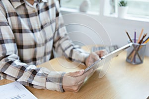 Businesspeople relaxing using digital tablet computer work study while sitting on chair in office