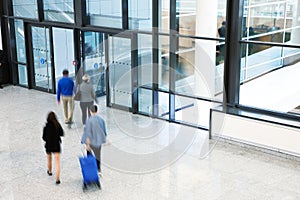 Businesspeople Rushing through Corridor, Motion Blur