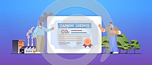 businesspeople signing carbon credits certificate document responsibility of co2 emission free trading carbon tax credit