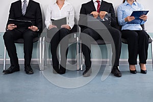 Businesspeople Sitting On Chair