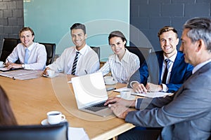 Businesspeople sitting in conference room during a meeting