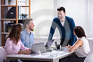 Businesspeople Sitting In Office During Meeting