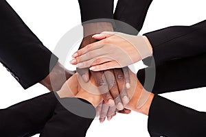 Businesspeople stacking hands