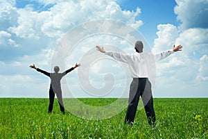 Businesspeople standing on green grass