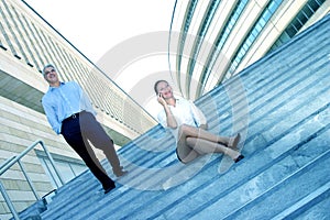 Businesspeople On Steps Of Office Complex