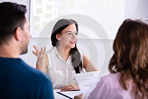 Businesspeople Taking Interview Of Woman