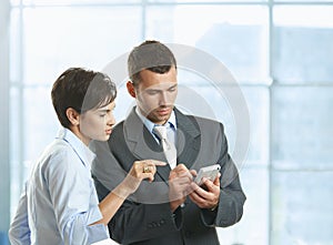 Businesspeople using mobile